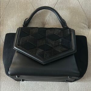 Welden handbag. New . Weathered cowhide and leather.
Classy.